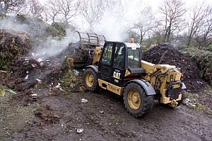 Recycling of green waste at a waste processing plant. The green waste is sorted, shredded, then processed over 16 weeks. This compost is then sold to the trade and through garden centres. Image credit: Defra, Crown Copyright.