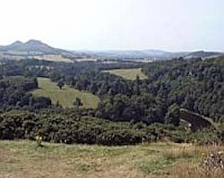 A mature river in Scotland looping its way through its fertile wooded valley