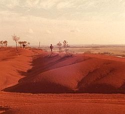 Encroachment of the desert in China. Over quite large areas the desert has encroached onto the agricultural land making it unsuitable for crops.