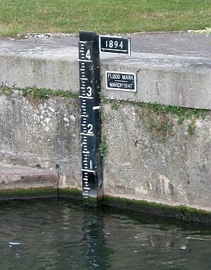 Flood height marker on the River Thames. Can you see how high the flood in 1894 reached? Be glad you werent living next to the river then!