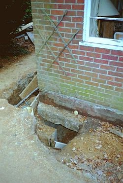 Clay-related subsidence affecting a house. Here the house has to be underpinned - which means rebuilding the foundations.